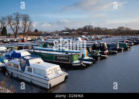 Fettlers Wharf Marina, in winter after snow on the Rufford branch of the Leeds Liverpool Canal, Ormskirk, Lancashire, UK Stock Photo