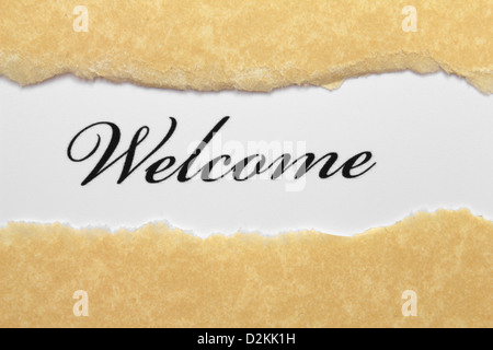 Welcome text on paper hole Stock Photo