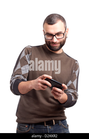Young man playing games on smartphone Stock Photo