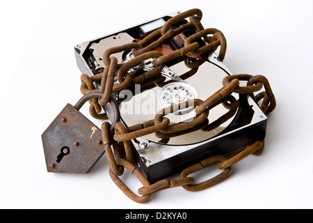 Opened hard disk secured with a strong iron chain and padlock Stock Photo