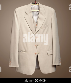 Beige jacket on hanger with Clipping path Stock Photo