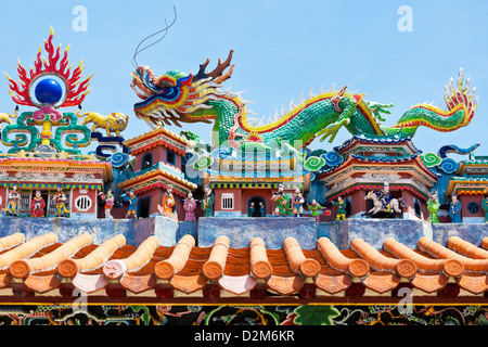 Dragon statues in Chinese style on top of temple roof Stock Photo