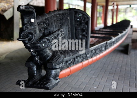 Native Maori carving on the prow of a war canoe shows how skillful these people were Stock Photo