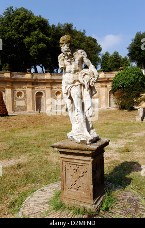 Villa Doria Pamphili. Rome. Italy. Statue of Pan and decorated stage wall, the only remaining feature of the open air theatre. Stock Photo