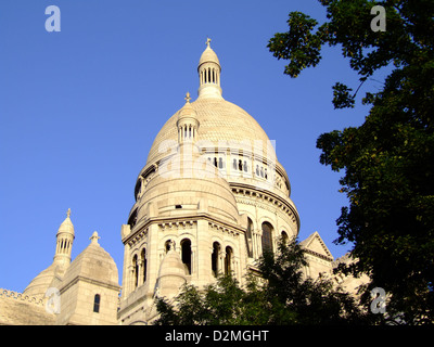 The Basilique du Sacré-Cœur is a prominent Roman Catholic church located at the highest point in Paris, on Montmartre Hill. Its striking white domes and architectural design make it one of the most visited landmarks in the city, offering panoramic views of Paris. Stock Photo