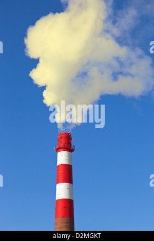 industrial chimney against blue sky Stock Photo - Alamy