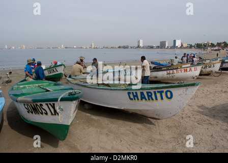 Commercial fishing boats, (Pangas) on the beach at Mazatlan,Mexico where fishermen prepare their night's catch for marketing. Stock Photo
