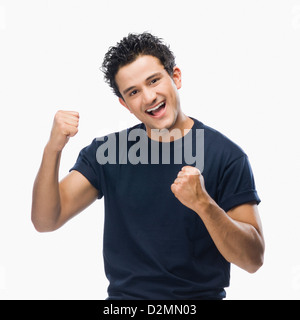 Portrait of a man making fist and smiling Stock Photo