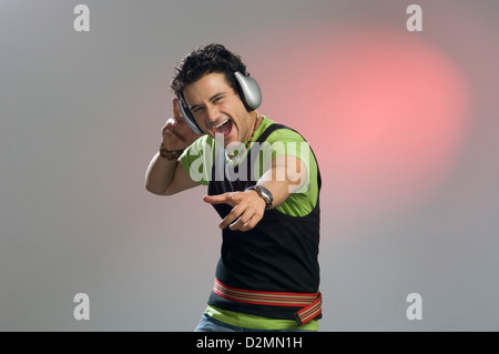 Man listening to music and looking excited Stock Photo