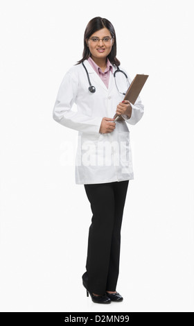Female doctor holding a clipboard and smiling Stock Photo
