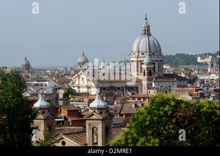 Rome. Italy. View from Pincio or Pinician Hill of the Rome skyline. In the foreground is the dome of church San Carlo al Corso. Stock Photo