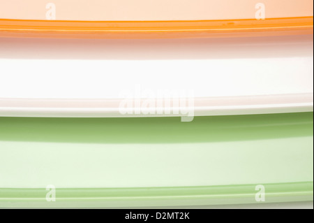 Close-up of a stack of colorful trays representing Indian flag colors Stock Photo