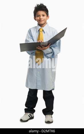Boy dressed as a businessman Stock Photo