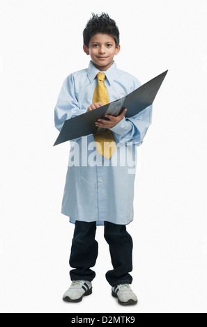 Boy dressed as a businessman Stock Photo