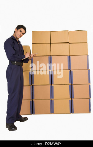 Store incharge checking inventory Stock Photo - Alamy