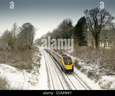 A First Great Western train service heads towards to Moreton in Marsh as it passes Norton Hall, Weston Subedge, Gloucestershire Stock Photo