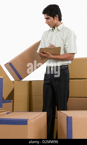 Store incharge checking inventory Stock Photo - Alamy