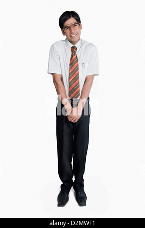 Man standing and looking shy Stock Photo