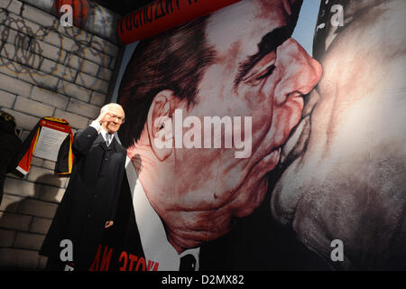 The wax figure depicting Erich Honecker, former Chairman of the State Council of the GDR, is pictured in front of the image showing the 'socialist fraternal kiss' of Honecker and Leonid Breschnew at the wax museum Madame Tussauds in Berlin, Germany, 04 December 2012. Photo: Jens Kalaene Stock Photo