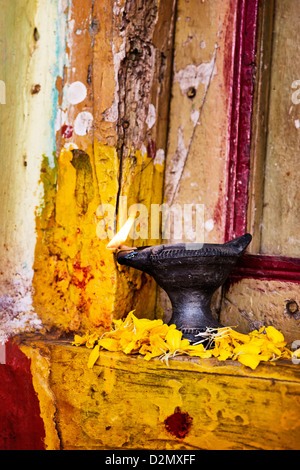 Burning indian oil lamp on the doorstep of a rural indian village house at Diwali festival. India Stock Photo