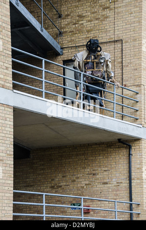 Robot sculpture looking over the balcony Stock Photo