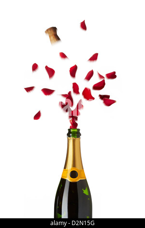 Bottle of champagne popping red rose petals with cork into the air on white background Stock Photo
