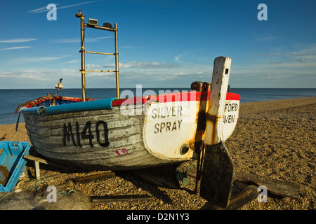 Fishing boat and nets on the seafront shingle beach of this popular unspoiled seaside town, Aldeburgh, Suffolk, England, UK Stock Photo