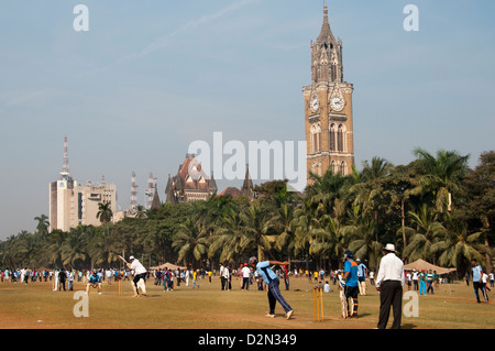 Weekend cricket matches at Maidan Park Mumbai Churchgate Bombay India background University of Mumbai  and Rajabai clock tower Stock Photo