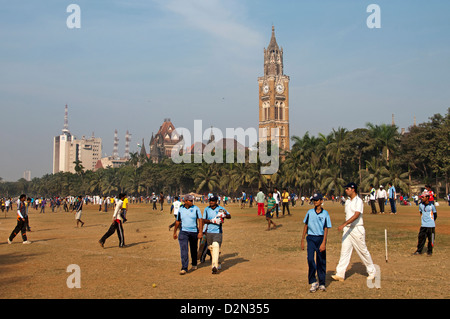 Weekend cricket matches at Maidan Park Mumbai Churchgate Bombay India background University of Mumbai  and Rajabai clock tower Stock Photo