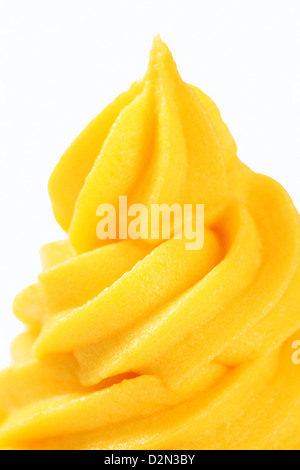 Swirl of yellow cream - detail Stock Photo