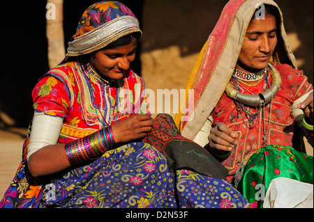 Mir tribal women with traditional attire doing embroidery work, Gujarat, India, Asia Stock Photo