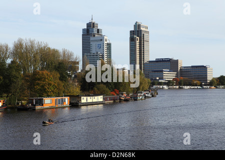 Skyscrapers and houseboats by the River Amstel in the Amstelveen district of Amsterdam, The Netherlands, Europe Stock Photo