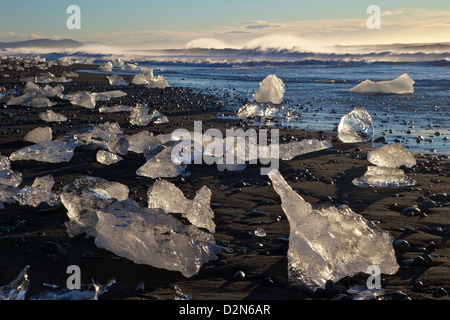 Icebergs on volcanic sand beach at Jokulsarlon, Iceland, Polar Regions Stock Photo