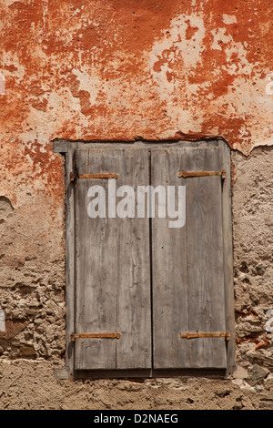Old window on a aged wooden wall Stock Photo - Alamy