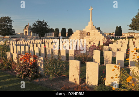 The Cross of Sacrifice at sundown in the Tyne Cot Commonwealth Cemetery in Zonnebeke, Belgium. Aug 2013 Stock Photo