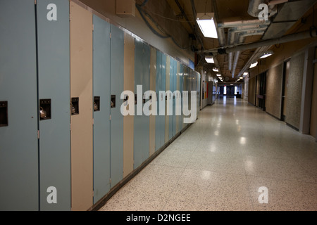 row of locked school lockers in empty corridor of High school canada north america Stock Photo