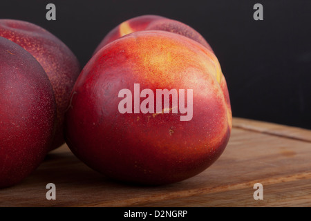photo of nectarines on a black background Stock Photo