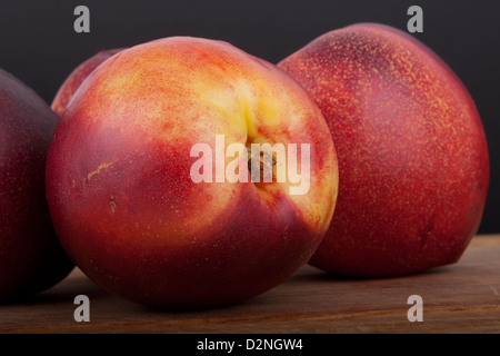photo of nectarines on a black background Stock Photo