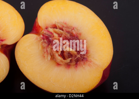 photo of peaches on a black background Stock Photo