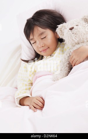 girl sleeping with teddy bear in bed Stock Photo - Alamy