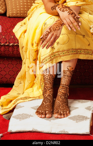 Bride's feet with henna decoration Stock Photo