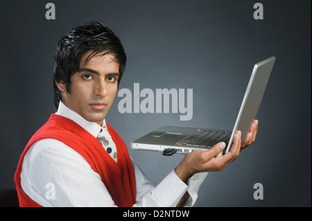 Portrait of a businessman using a laptop Stock Photo