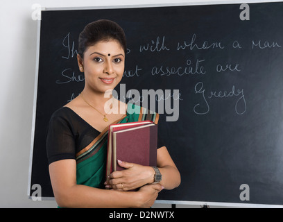 Portrait of Asian female teacher in classroom Stock Photo - Alamy