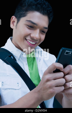 Man text messaging on a mobile phone Stock Photo