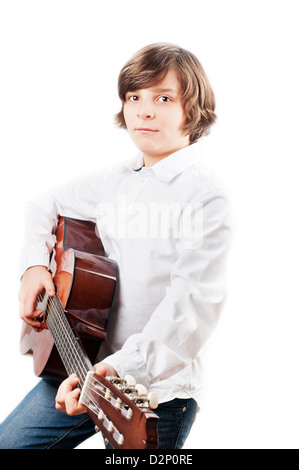 White boy school years in a white shirt with a guitar on a white background Stock Photo