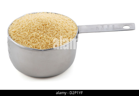 Cous cous presented in an American metal cup measure, isolated on a white background Stock Photo