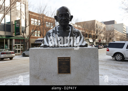 mahatma gandhi bust sculpture in snow downtown Saskatoon Saskatchewan Canada Stock Photo