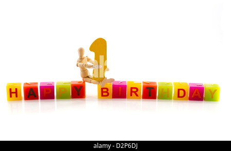 happy birthday candle letters with puppet and the number one Stock Photo