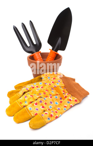 Gardening: group of tools and accessories (gloves, flower pot, trowel and digging fork), isolated on white background Stock Photo