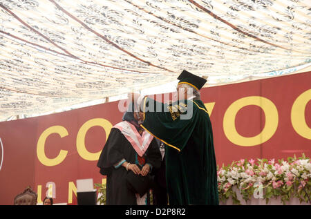 Karachi University Vice Chancellor, Dr. Muhammad Qaisar  awarding gold medal to successful student during Annual Convocation 2013, held at Valika  Ground in Karachi University premises on Wednesday, January 30, 2013. Stock Photo